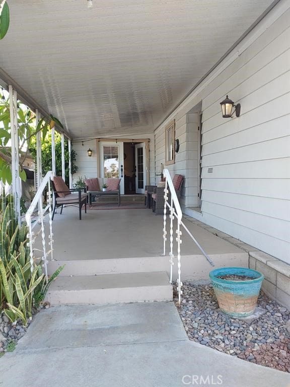 view of patio featuring a porch