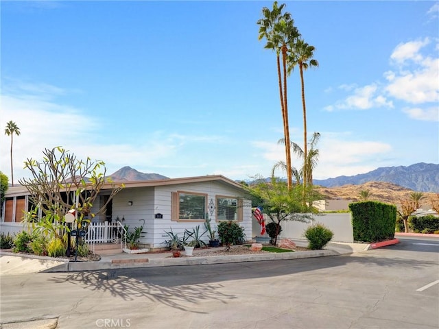 ranch-style home with a mountain view