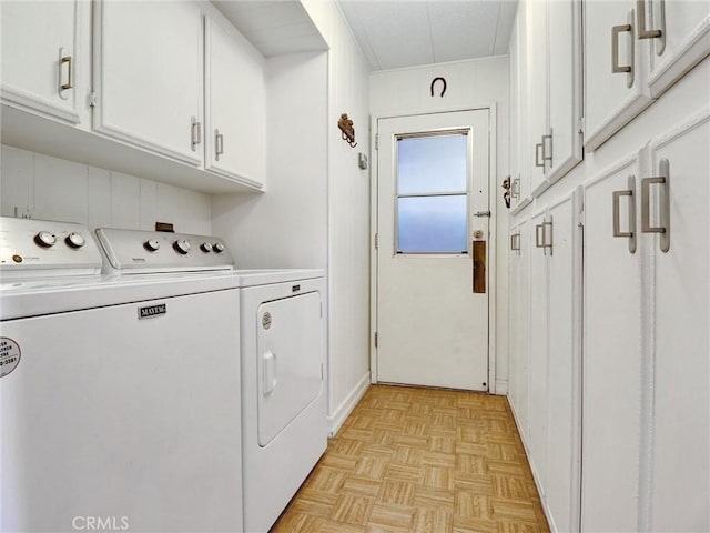 laundry area with cabinet space and washing machine and dryer