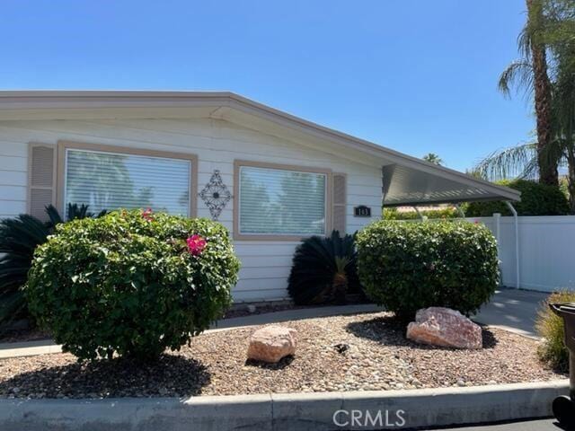 view of front of house with fence