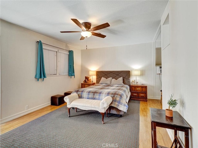 bedroom featuring ceiling fan and light wood-type flooring