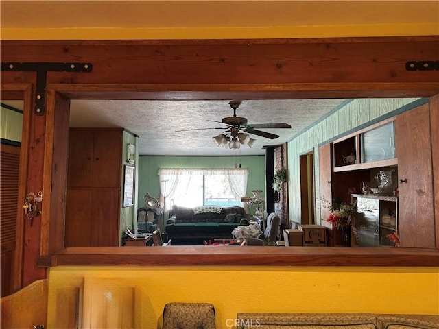 kitchen featuring a textured ceiling and a ceiling fan