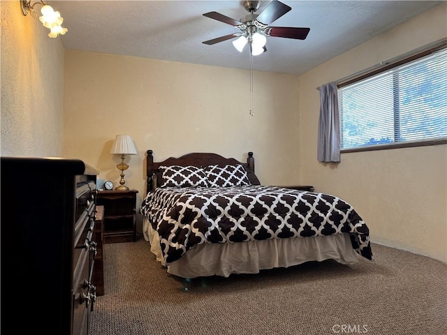 bedroom featuring ceiling fan and carpet floors