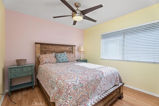 bedroom featuring ceiling fan and hardwood / wood-style floors