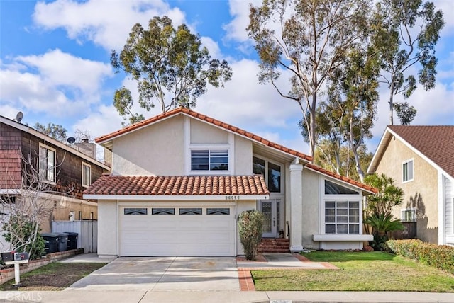 view of front facade with a garage and a front lawn