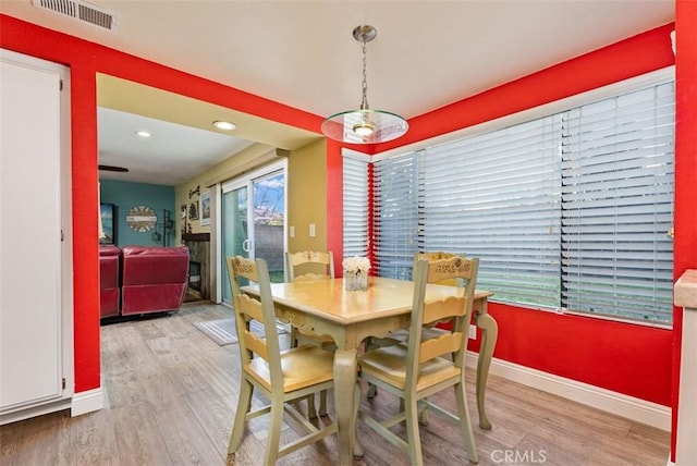 dining area with hardwood / wood-style floors