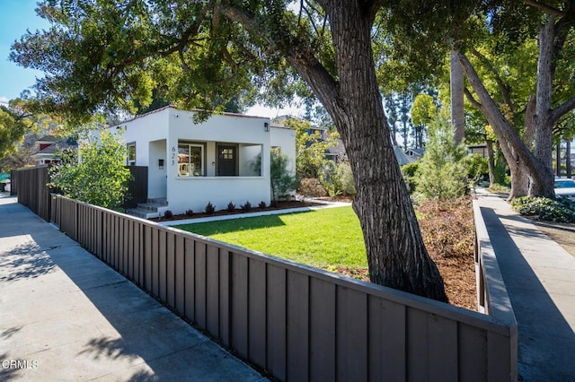 contemporary home featuring a front yard