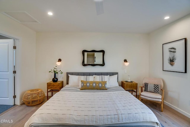 bedroom with ceiling fan and light wood-type flooring