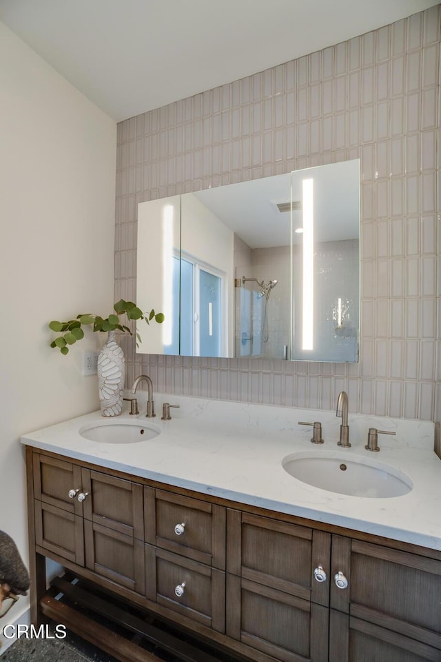 bathroom featuring vanity and walk in shower