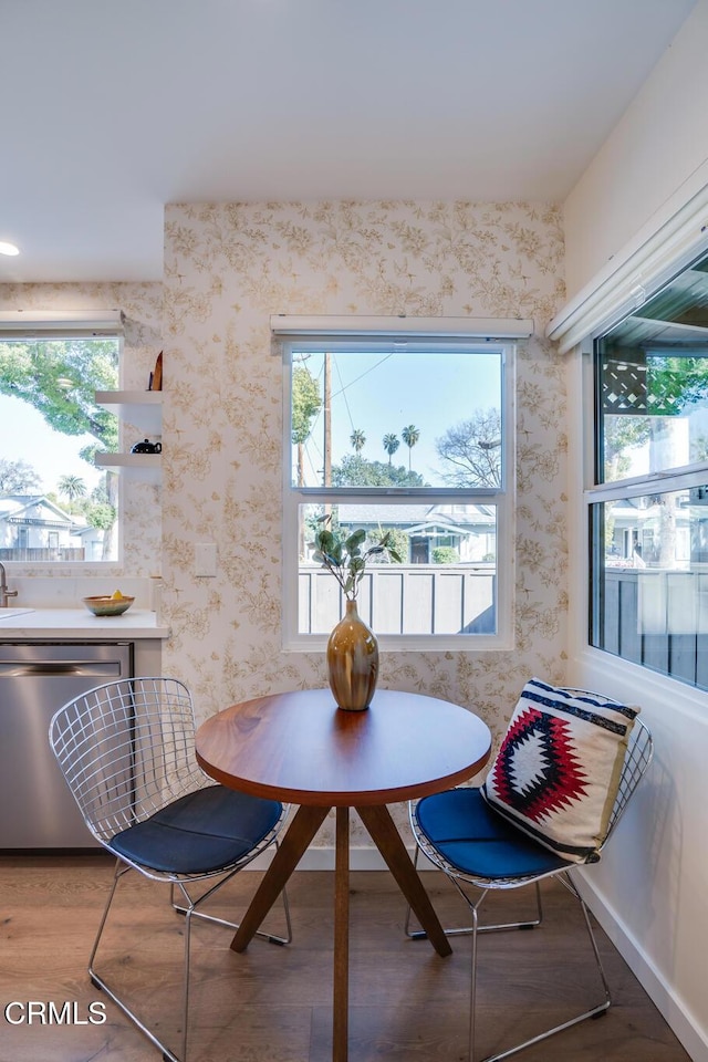 dining area featuring hardwood / wood-style floors and a healthy amount of sunlight