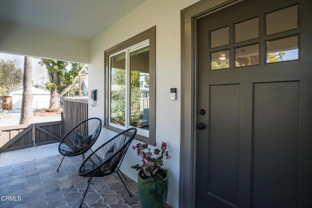 doorway to property featuring covered porch