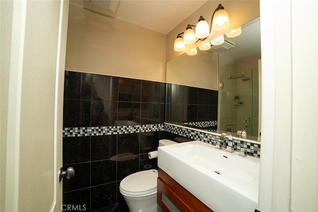 1745 N Winery Ave Unit 102, Fresno, CA 93703 - full bathroom with toilet, vanity, a shower stall, and tile walls