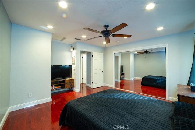 bedroom featuring baseboards, visible vents, wood finished floors, and recessed lighting