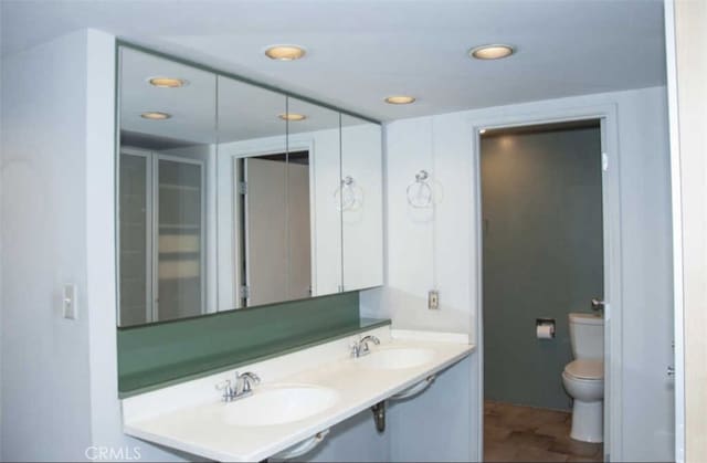 bathroom featuring sink and toilet