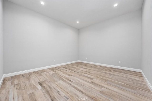 unfurnished room featuring light wood-type flooring