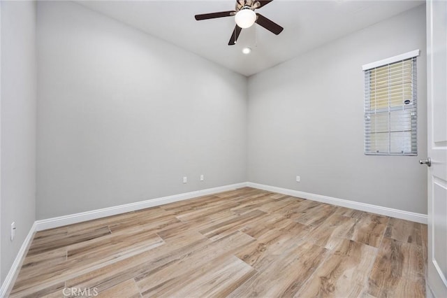 unfurnished room featuring ceiling fan and light hardwood / wood-style floors