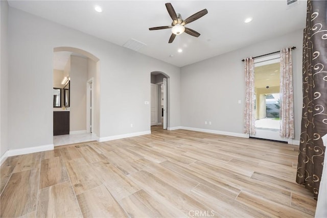 unfurnished room featuring ceiling fan and light wood-type flooring