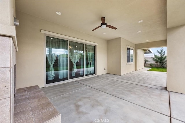 view of patio / terrace featuring ceiling fan