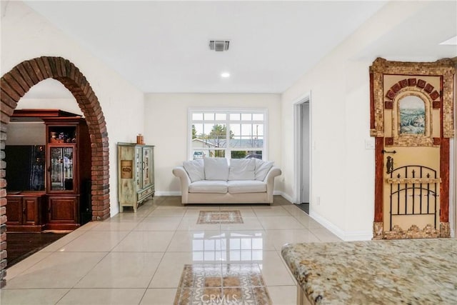 living area featuring light tile patterned floors