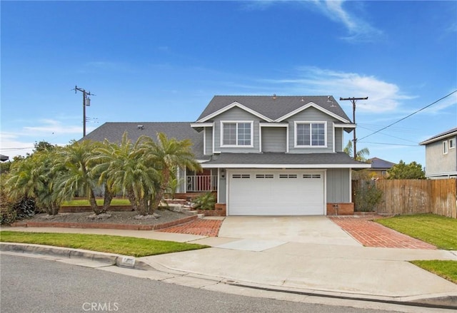 view of front of property with a garage and a front yard