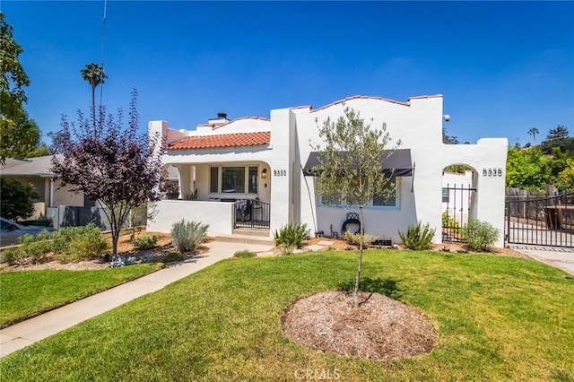 5333 Hartwick St, Los Angeles, CA 90041 - view of front facade with a gate, stucco siding, a fenced front yard, a chimney, and a tile roof