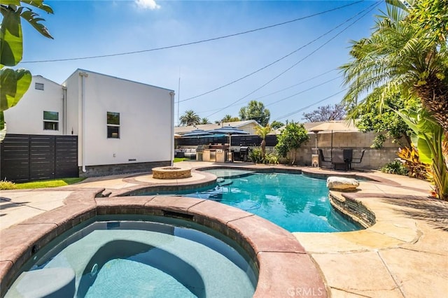 view of swimming pool with an in ground hot tub and a patio