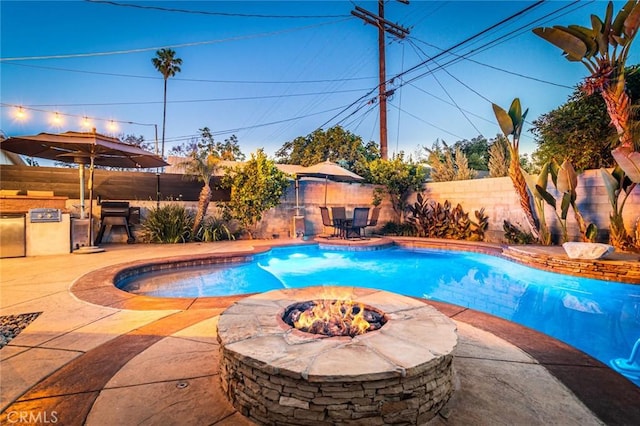 5333 Hartwick St, Los Angeles, CA 90041 - view of pool featuring a fire pit, a fenced backyard, a patio area, area for grilling, and outdoor dining area