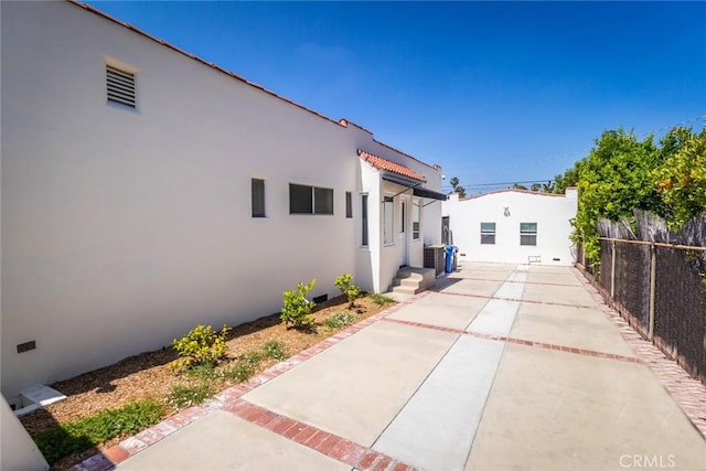 view of property exterior featuring a patio area