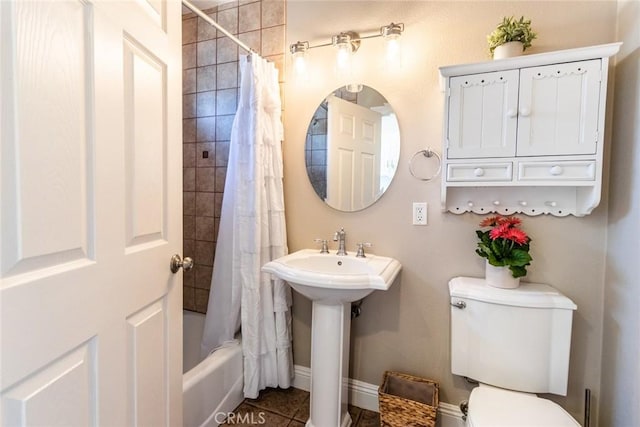 full bathroom with tile patterned flooring, sink, shower / bath combination with curtain, and toilet