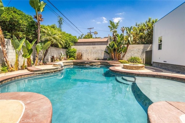 view of pool with an in ground hot tub