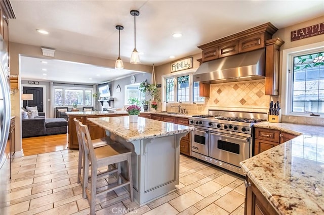 5333 Hartwick St, Los Angeles, CA 90041 - kitchen featuring double oven range, ventilation hood, open floor plan, recessed lighting, and backsplash