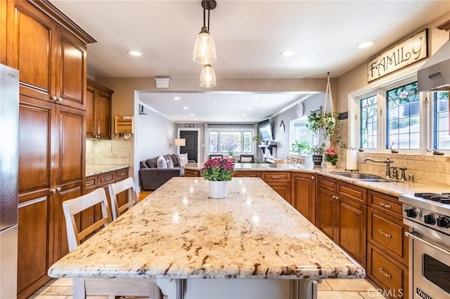 5333 Hartwick St, Los Angeles, CA 90041 - kitchen with recessed lighting, appliances with stainless steel finishes, healthy amount of natural light, backsplash, and light stone countertops