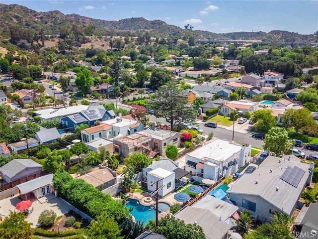 birds eye view of property with a mountain view