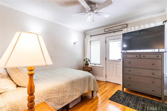 bedroom with ceiling fan, ornamental molding, and light hardwood / wood-style flooring