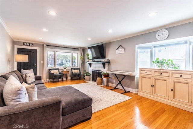 5333 Hartwick St, Los Angeles, CA 90041 - living room featuring crown molding, light wood finished floors, recessed lighting, and a fireplace