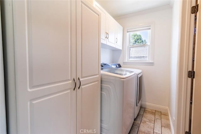 5333 Hartwick St, Los Angeles, CA 90041 - laundry area featuring cabinet space, separate washer and dryer, ornamental molding, and stone tile flooring