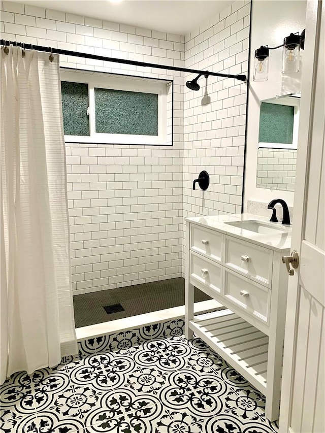 bathroom with vanity, a shower with curtain, and tile patterned floors