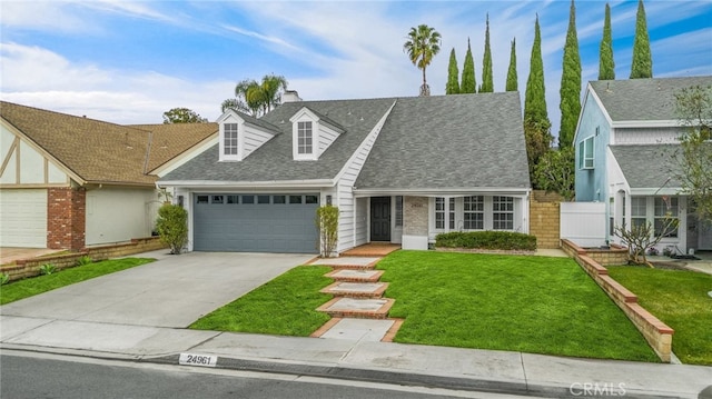 view of front of property with a garage and a front yard