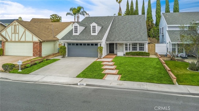 view of front of property with a garage and a front yard