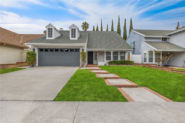 view of front of home with a garage and a front yard