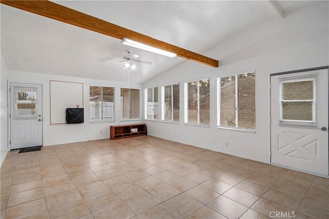 unfurnished sunroom with ceiling fan, plenty of natural light, and lofted ceiling with beams