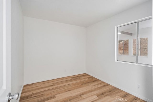 empty room featuring wood-type flooring