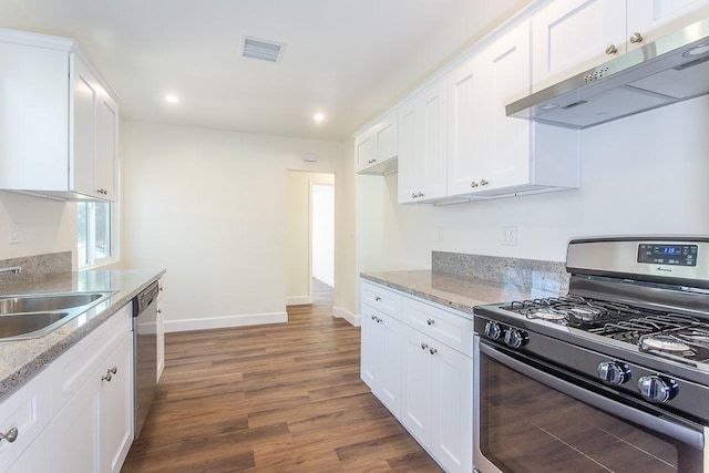 kitchen featuring stainless steel appliances, dark hardwood / wood-style flooring, sink, and white cabinets