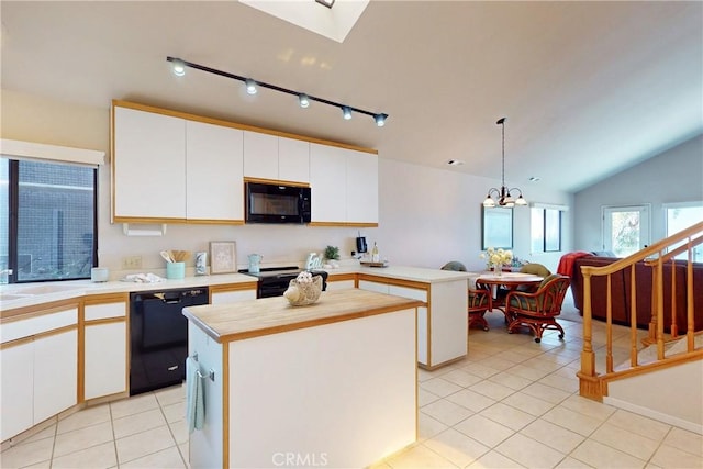 kitchen featuring white cabinetry, black appliances, and light tile patterned floors