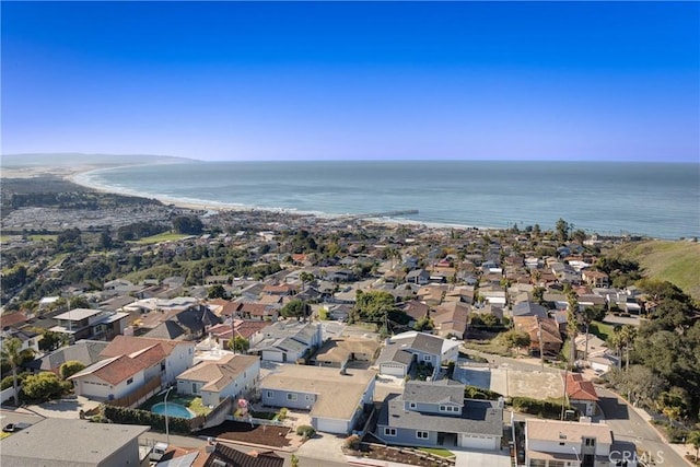 drone / aerial view with a residential view and a water view