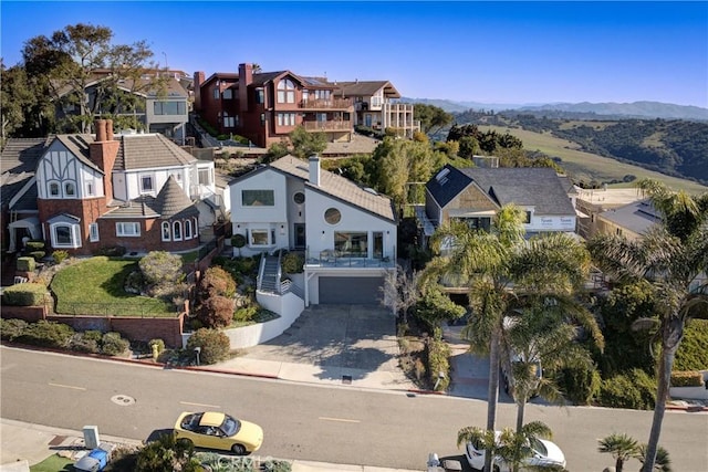 drone / aerial view featuring a mountain view and a residential view