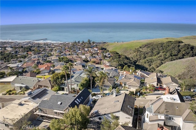 birds eye view of property with a water view and a residential view