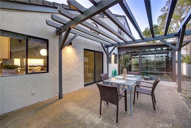view of patio with outdoor dining area and a pergola