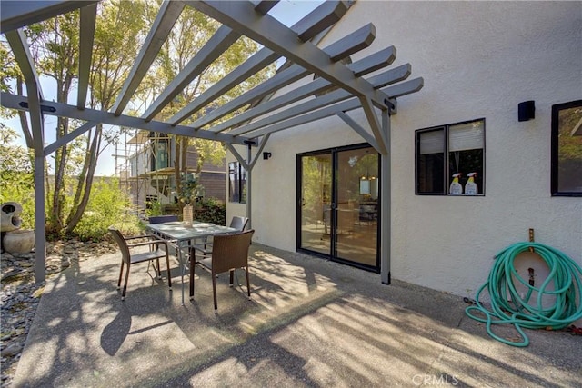 view of patio / terrace featuring outdoor dining area and a pergola