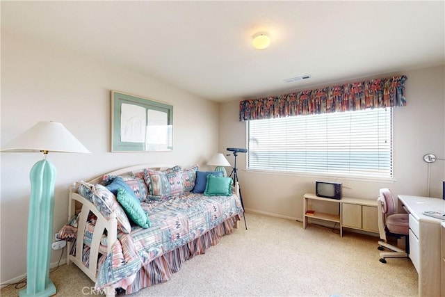 carpeted bedroom with baseboards and visible vents